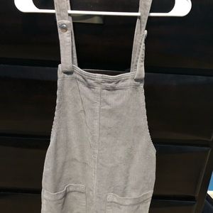 A grey corduroy pinafore